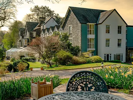 Exterior of hotel and grounds to signify exclusive use