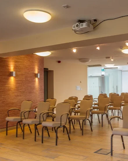 Large meeting room conference suite arranged for a conference presentation