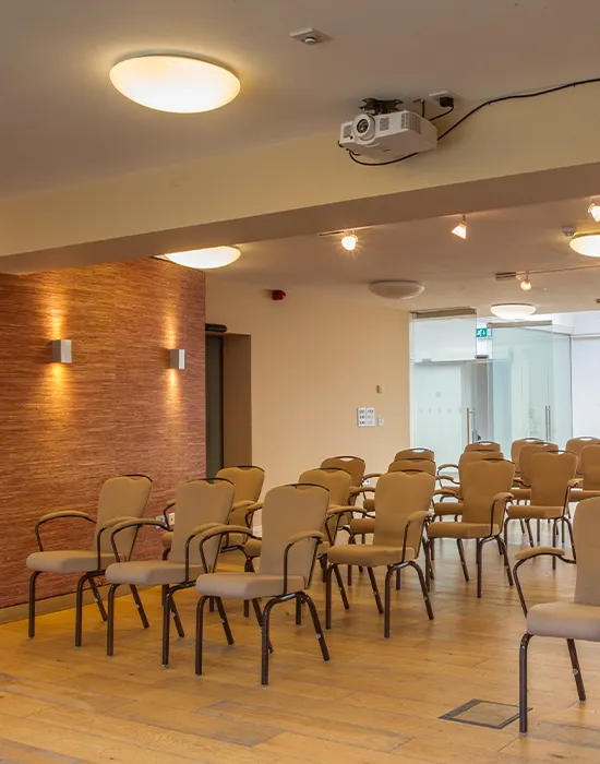 Large meeting room conference suite arranged for a conference presentation