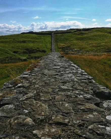 View along hadrians wall with fields either side