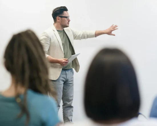 Business man presenting in front of an audience