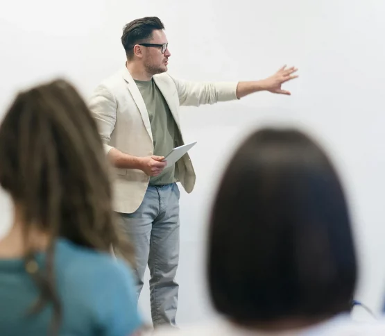 Business man presenting in front of an audience