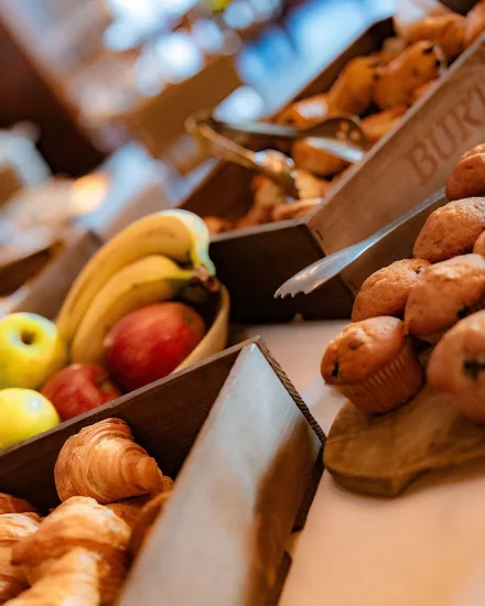 Fruit, pastries and breakfast muffins in buffet style