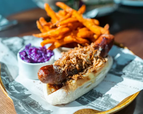 Gourmet hot dog with sweet potato fries