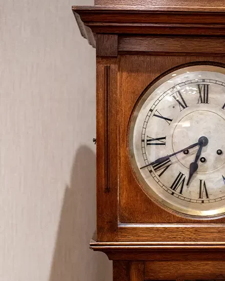 An antique wooden grandfather clock
