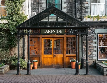Lakeside Hotel main entrance featuring canopy and traditional wooden doors with stained glass