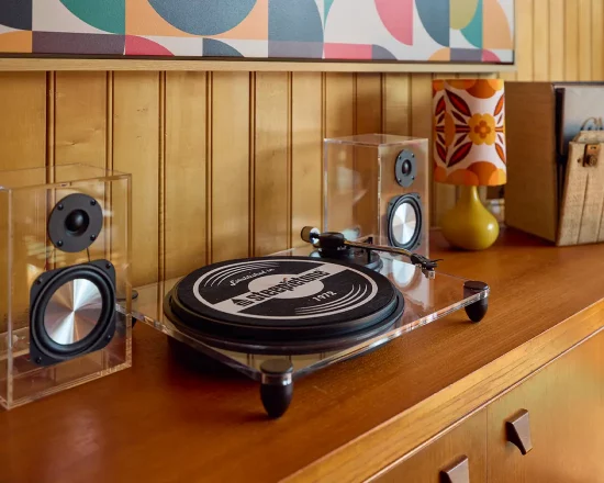 Modern vinyl turntable on sideboard