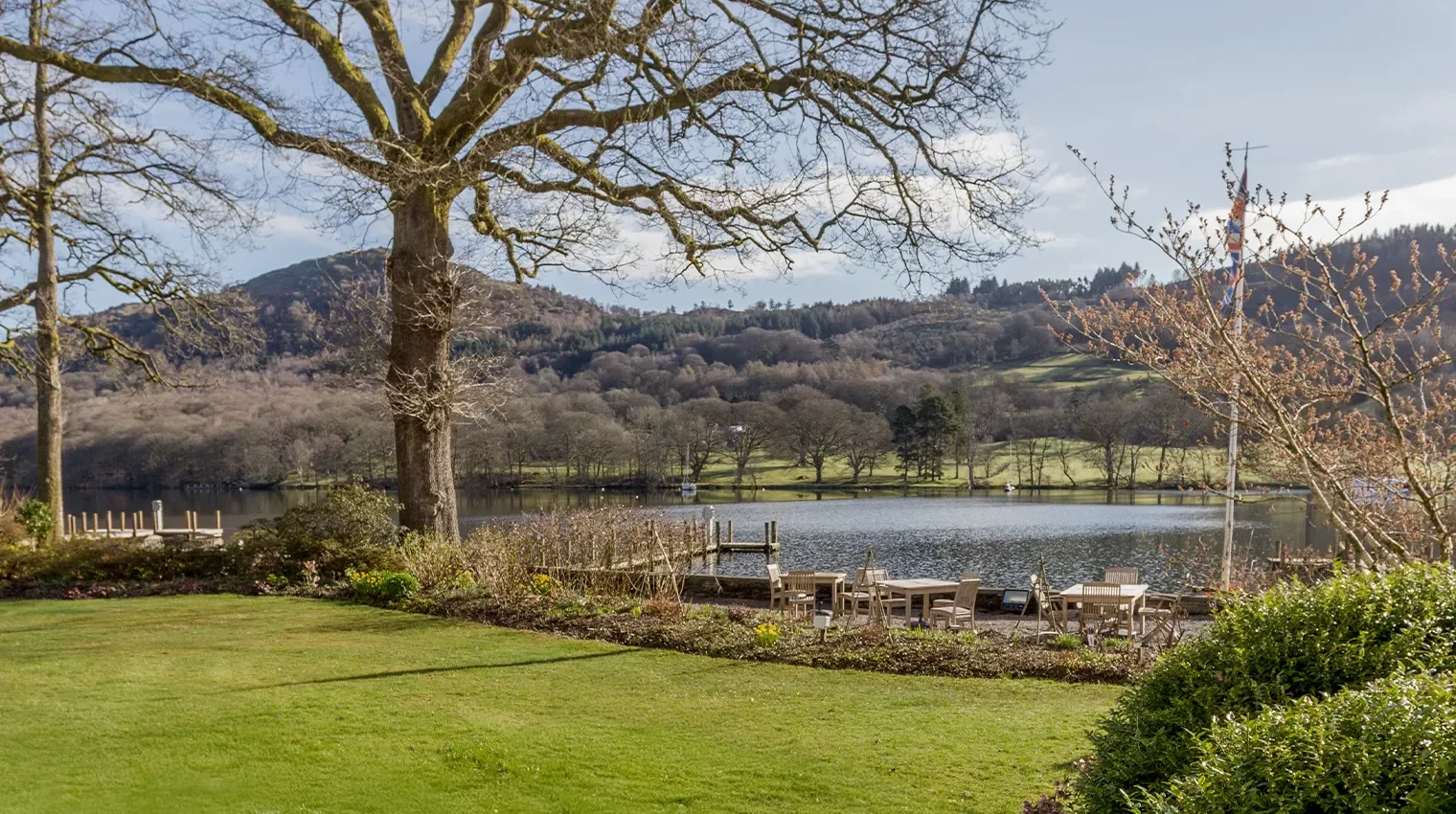 View of Lake Windermere, the fells and garden from a bedroom with a lake view