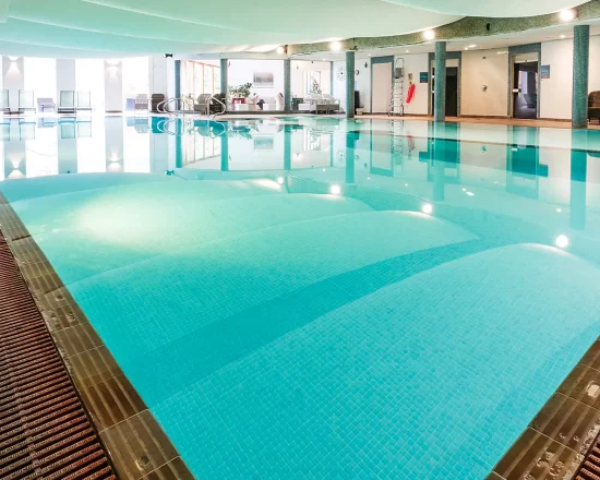 Swimming pool interior with bright blue water