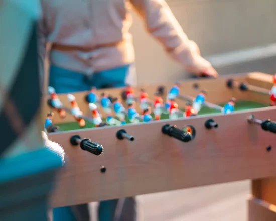 Close up view of kids playing table football game