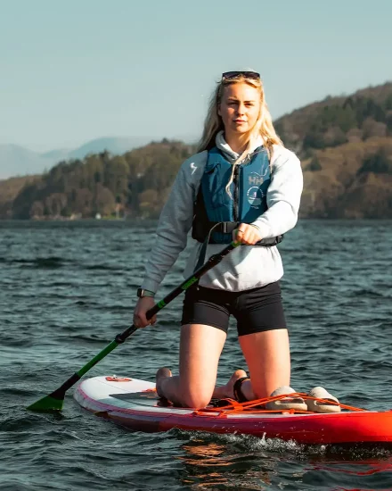Girl paddleboarding on Lake Windermere