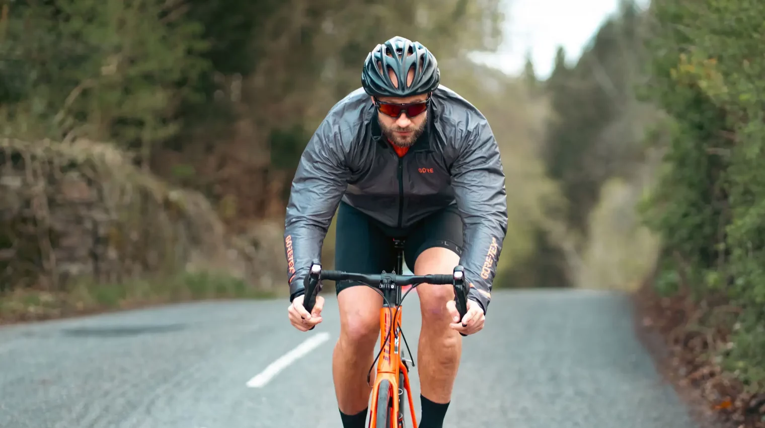 Man cycling on a Lake District country road
