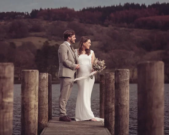 Married couple celebrate their wedding on the jetty