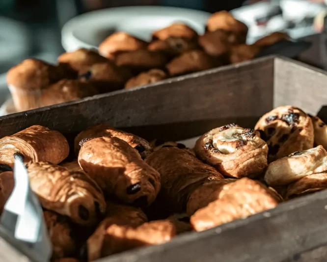 Selection of pastries for breakfast in wooden trays