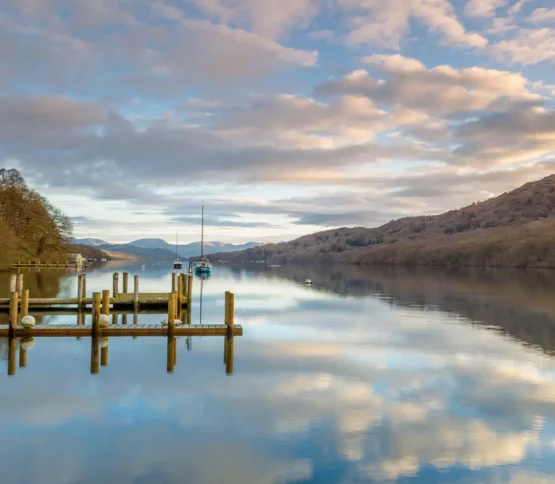 Serene view down Lake Windermere from Lakeside Hotel with the lake and fells and a dusk sky