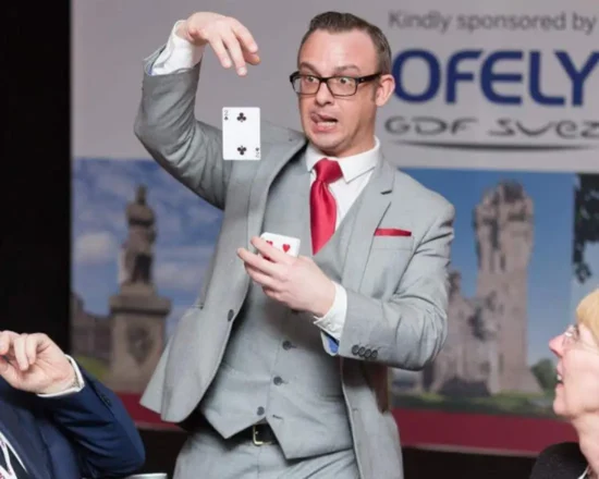 Table magician doing a card trick